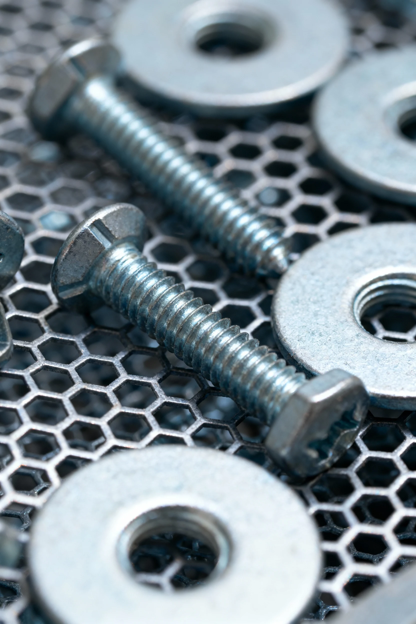 closeup of 1/2-inch hardware cloth, screws and fender washers